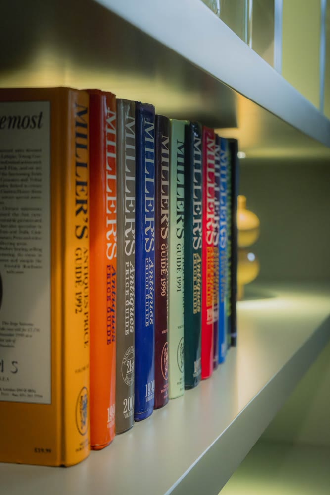 Bookshelf with colourful books in a common area of the hotel
